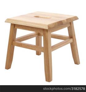 Small four legged wooden step stool over white.