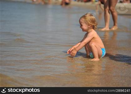 small girl having fun at sea