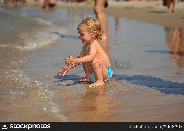 small girl having fun at sea
