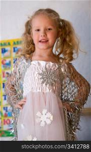 Small girl in holiday carnival snowflake costume
