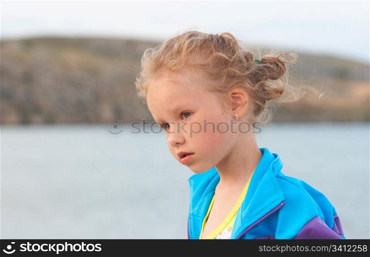 Small girl outdoor portrait (near sea)