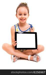 Small girl playing with her new tablet computer