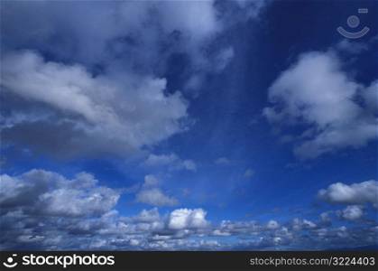 Small Gray Clouds In A Blue Sky