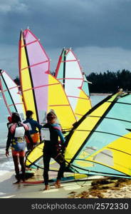 Small group of windsurfers gearing up for a competition, Nassau, Bahamas