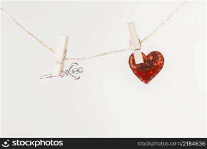 small heart with key hanging rope