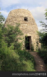 Small historical stone watchtower (museum of Ukrainian folk architecture in Pirogovo village (near Kiev))