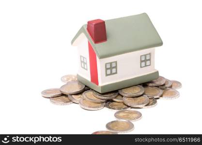 small house and coins, concept, isolated on white background. small house and coins