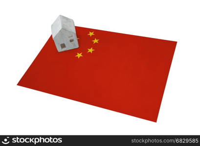 Small house on a flag - Living or migrating to China