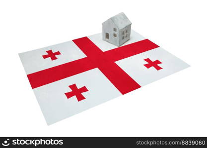 Small house on a flag - Living or migrating to Georgia