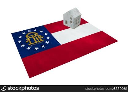 Small house on a flag - Living or migrating to Georgia