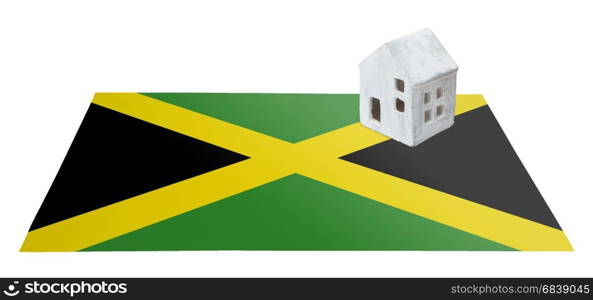 Small house on a flag - Living or migrating to Jamaica