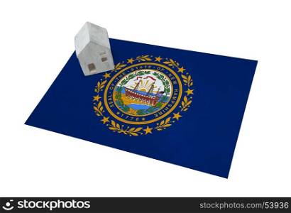Small house on a flag - Living or migrating to New Hampshire