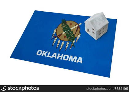 Small house on a flag - Living or migrating to Oklahoma