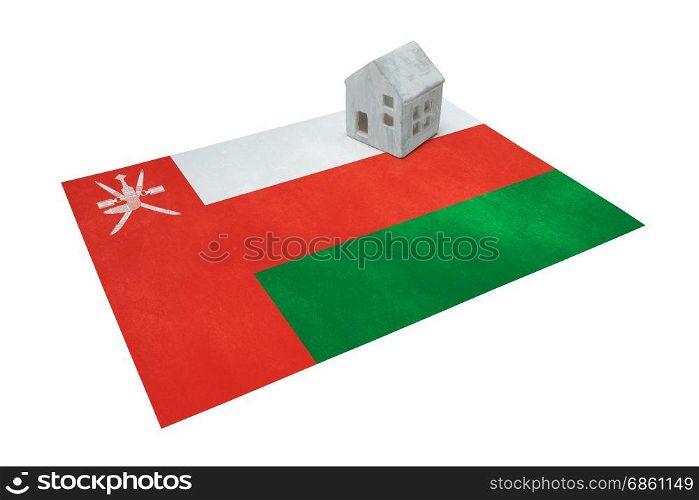 Small house on a flag - Living or migrating to Oman