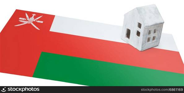 Small house on a flag - Living or migrating to Oman