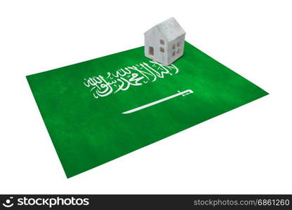 Small house on a flag - Living or migrating to Saudi Arabia
