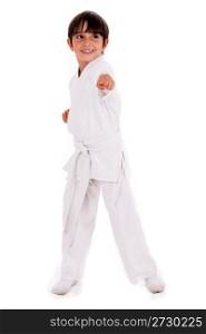 Small karate boy in training isolated white background