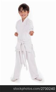 Small karate boy in training isolated white background