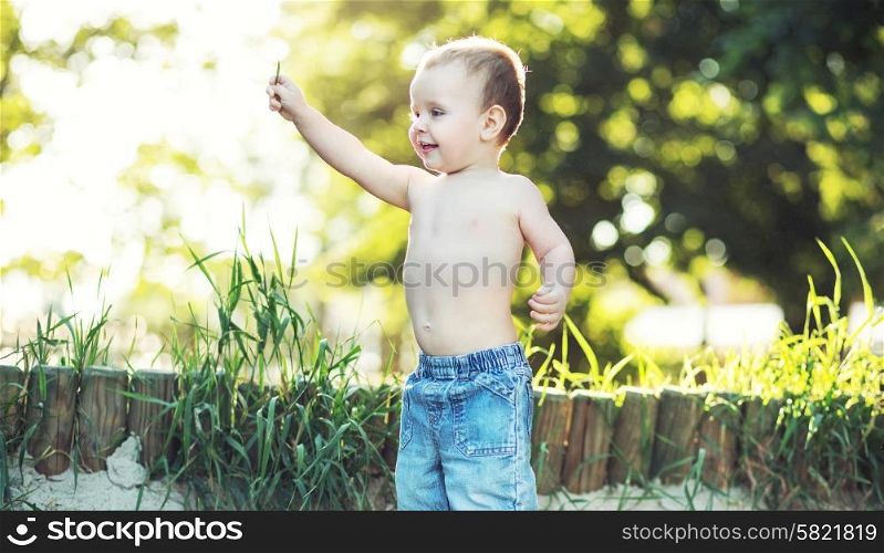 Small kid playing in the garden