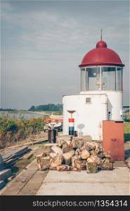 Small lighthouse in the marina of Marken island, the Netherlands.