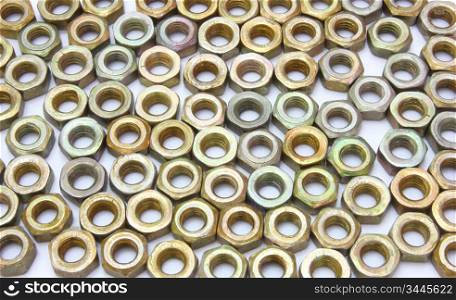 Small metal nuts on a white background a structure