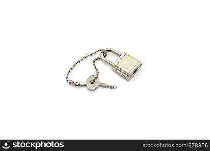 Small metallic padlock and key for bag or suitcase isolated on white background