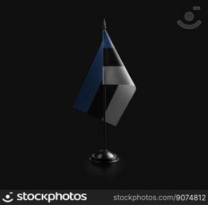 Small national flag of the Estonia on a black background.. Small national flag of the Estonia on a black background