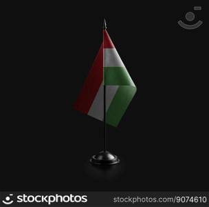Small national flag of the Hungary on a black background.. Small national flag of the Hungary on a black background