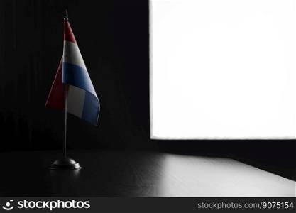 Small national flag of the Netherlands on a black background.. Small national flag of the Netherlands on a black background
