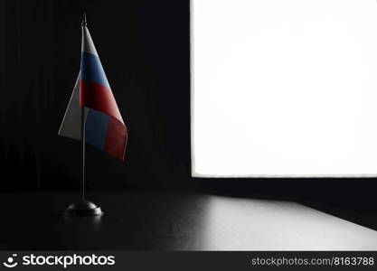 Small national flag of the Russia on a black background.. Small national flag of the Russia on a black background
