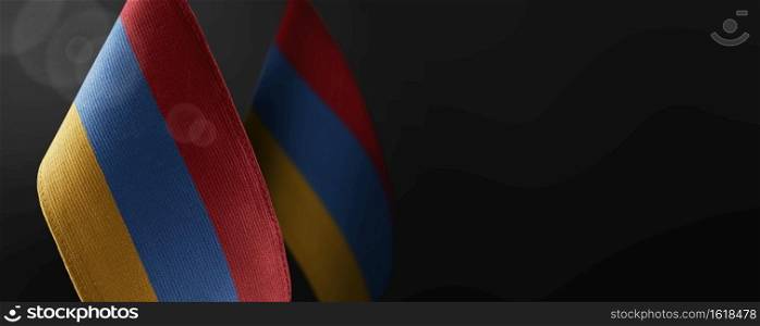 Small national flags of the Armenia on a dark background.. Small national flags of the Armenia on a dark background