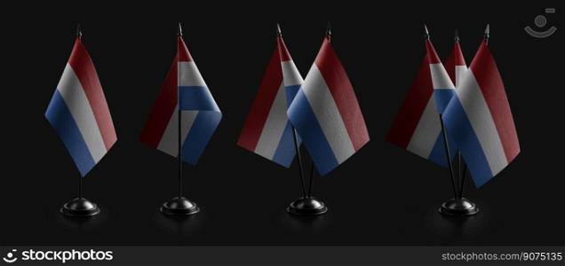 Small national flags of the Netherlands on a black background.. Small national flags of the Netherlands on a black background