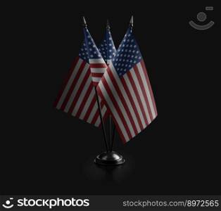 Small national flags of the USA on a black background.. Small national flags of the USA on a black background