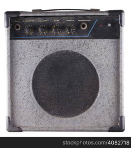 Small old dusty amp for guitar and bass guitar, isolated over white