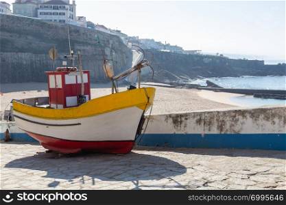 small old fishing boat on coast after catch
