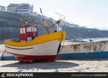 small old fishing boat on coast after catch