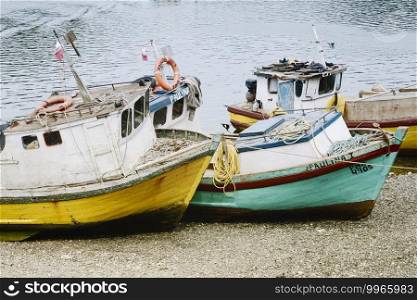 Small Old Fishing Boats On The Beach, Puerto Montt, Chile 