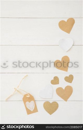small paper hearts scattered table