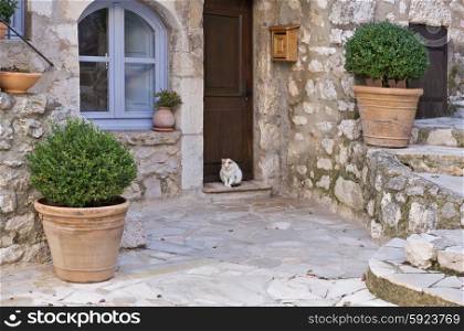Small patio with flowers in the old village Gourdon, France
