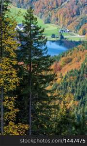 Small picturesque autumn Alps mountain lake Krotensee view from path to Schafberg viewpoint from Winkl, Salzkammergut, Upper Austria. Beautiful hiking, seasonal, and nature beauty concept scene.