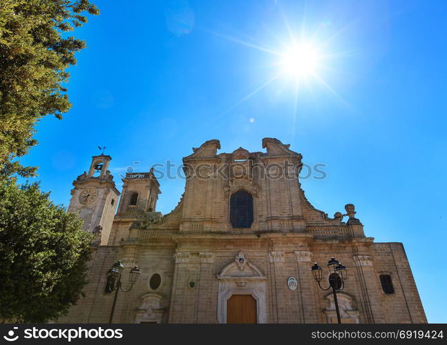 Small picturesque medieval town Oria Cathedral Basilica sunshiny view, Brindisi region, Puglia, Italy. Natural sunshine with some lens flare effect. Build in 1756.