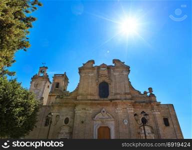 Small picturesque medieval town Oria Cathedral Basilica sunshiny view, Brindisi region, Puglia, Italy. Natural sunshine with some lens flare effect. Build in 1756.