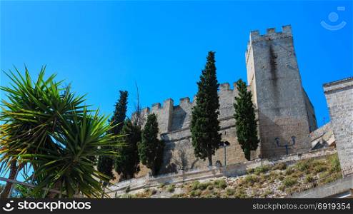 Small picturesque medieval town Oria fortress wall and tower view, Brindisi region, Puglia, Italy.