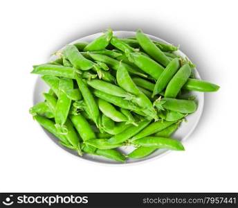 Small pile of green peas in pods on white plate isolated on white background