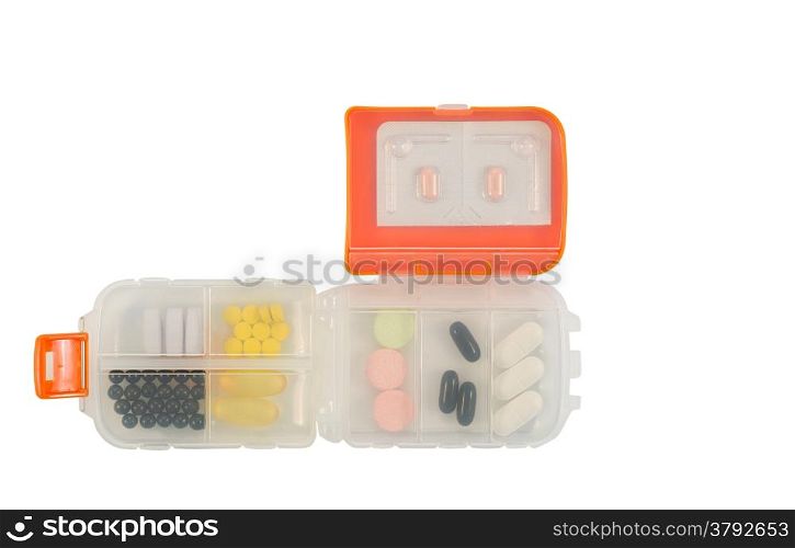 Small plastic medicine container filled with various pills inside isolated on white
