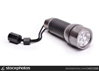 Small pocket flashlight at white background