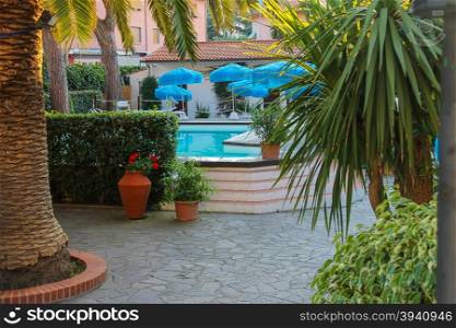 Small pool in the courtyard of the villa in sea resort. Elba Island, Italy