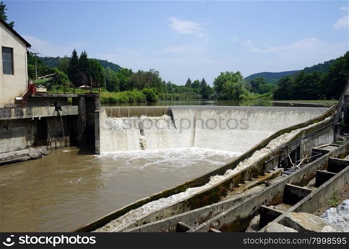 Small power station ond dam on the river, France