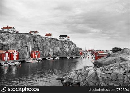 small red huts at the ocean in scandinavia