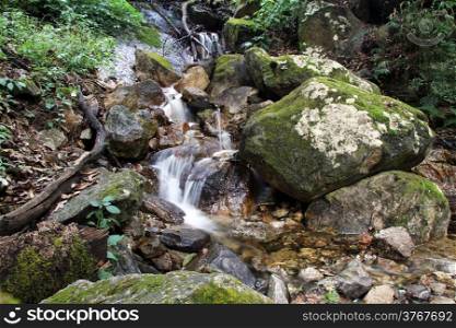 Small river and rocks in mountain in Nepal